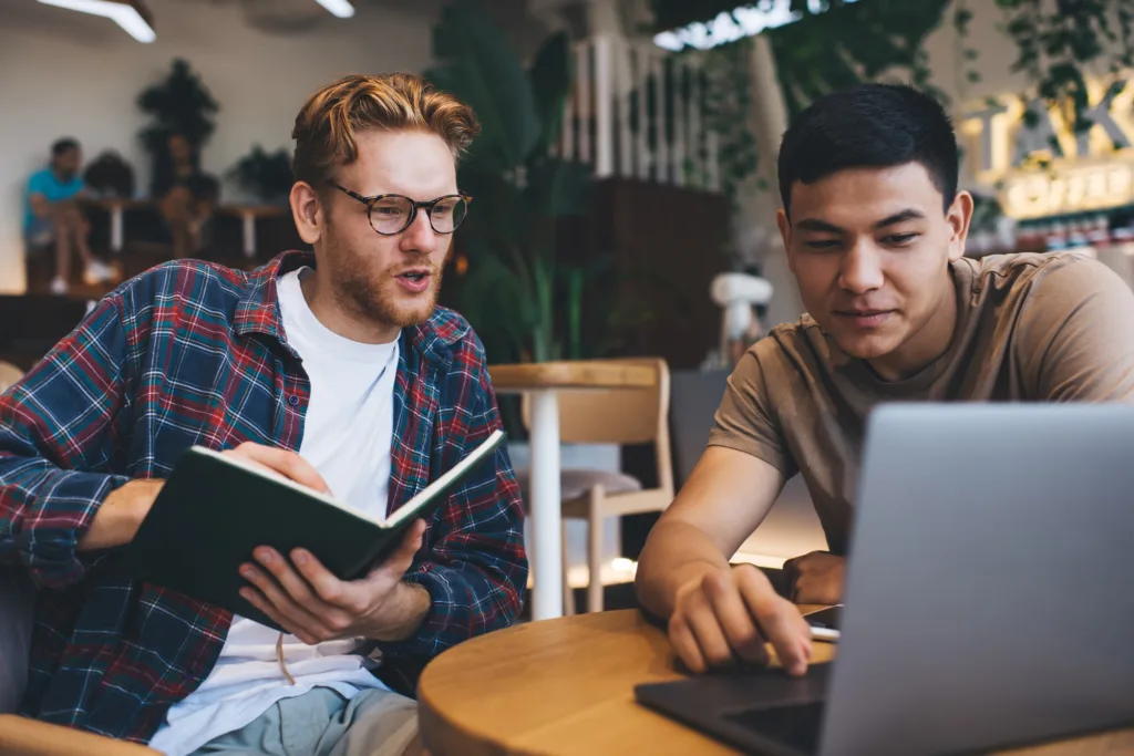 Multiracial business men working in office space